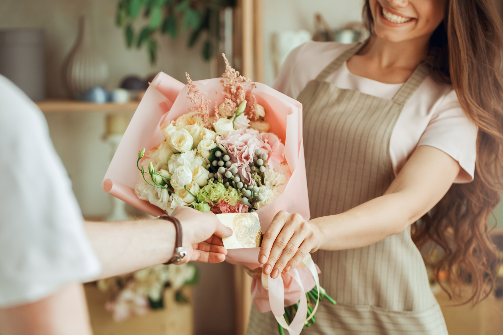 Young woman florist occupation working with flowers